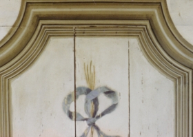 A small section of a panel decorated with flowers. Trompe l'oeil and Grisaille
